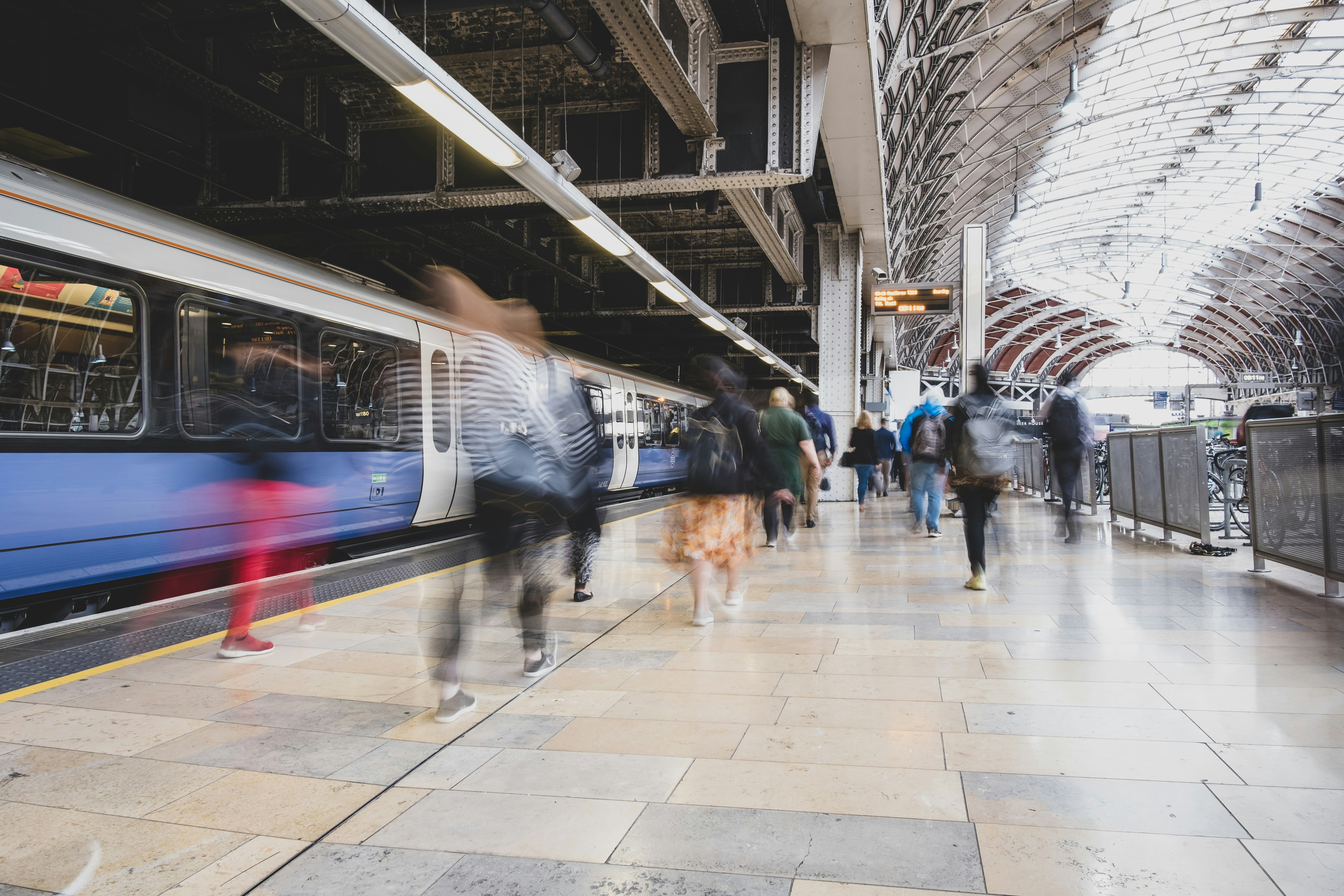 Rail: busy station platform with an arriving train